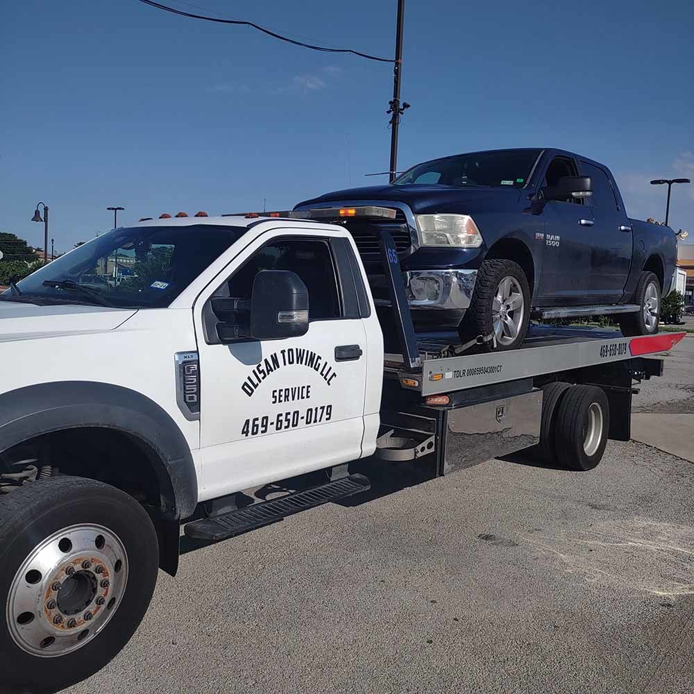 truck on the back of a tow truck