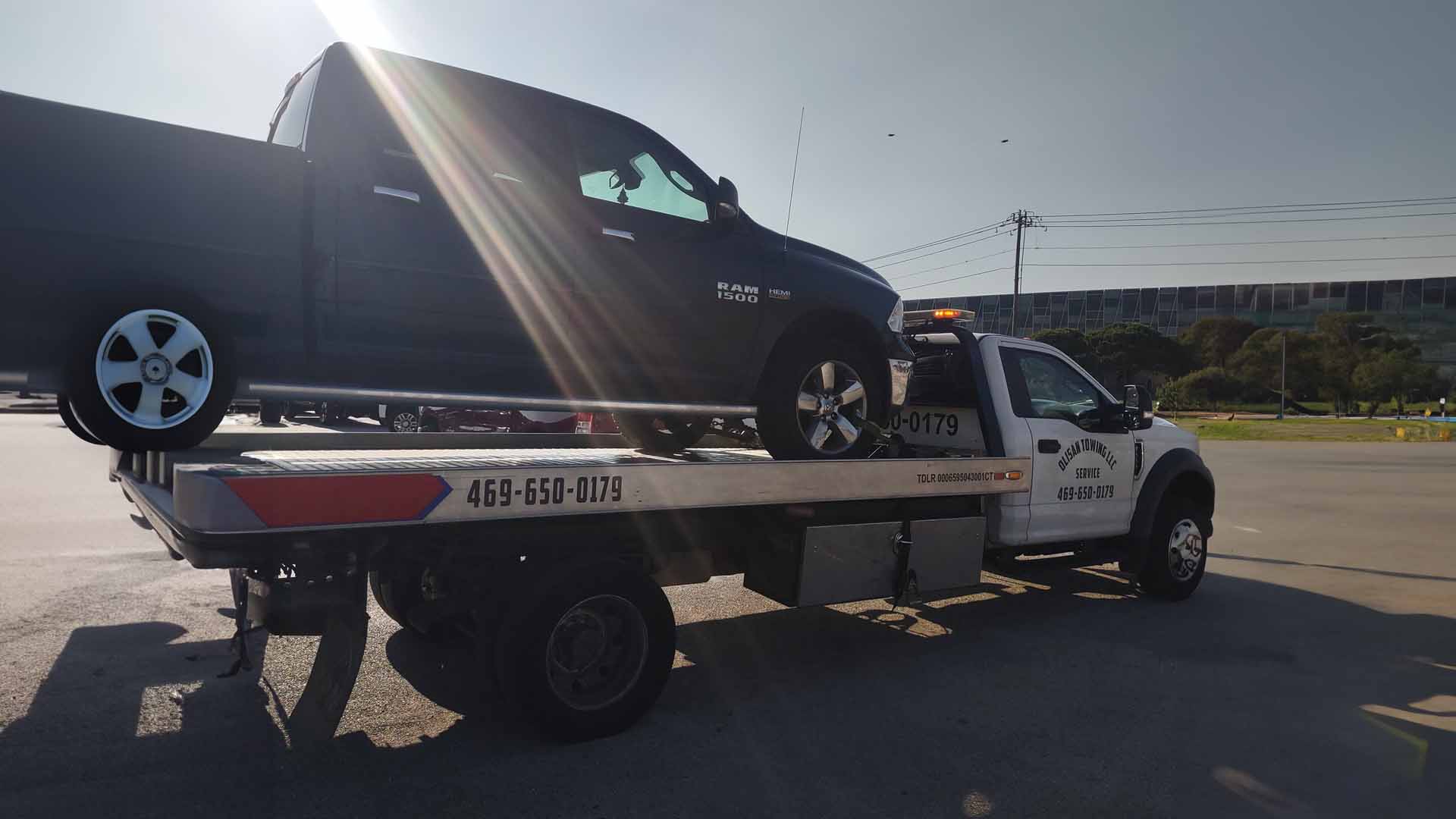 truck on the back of a tow truck