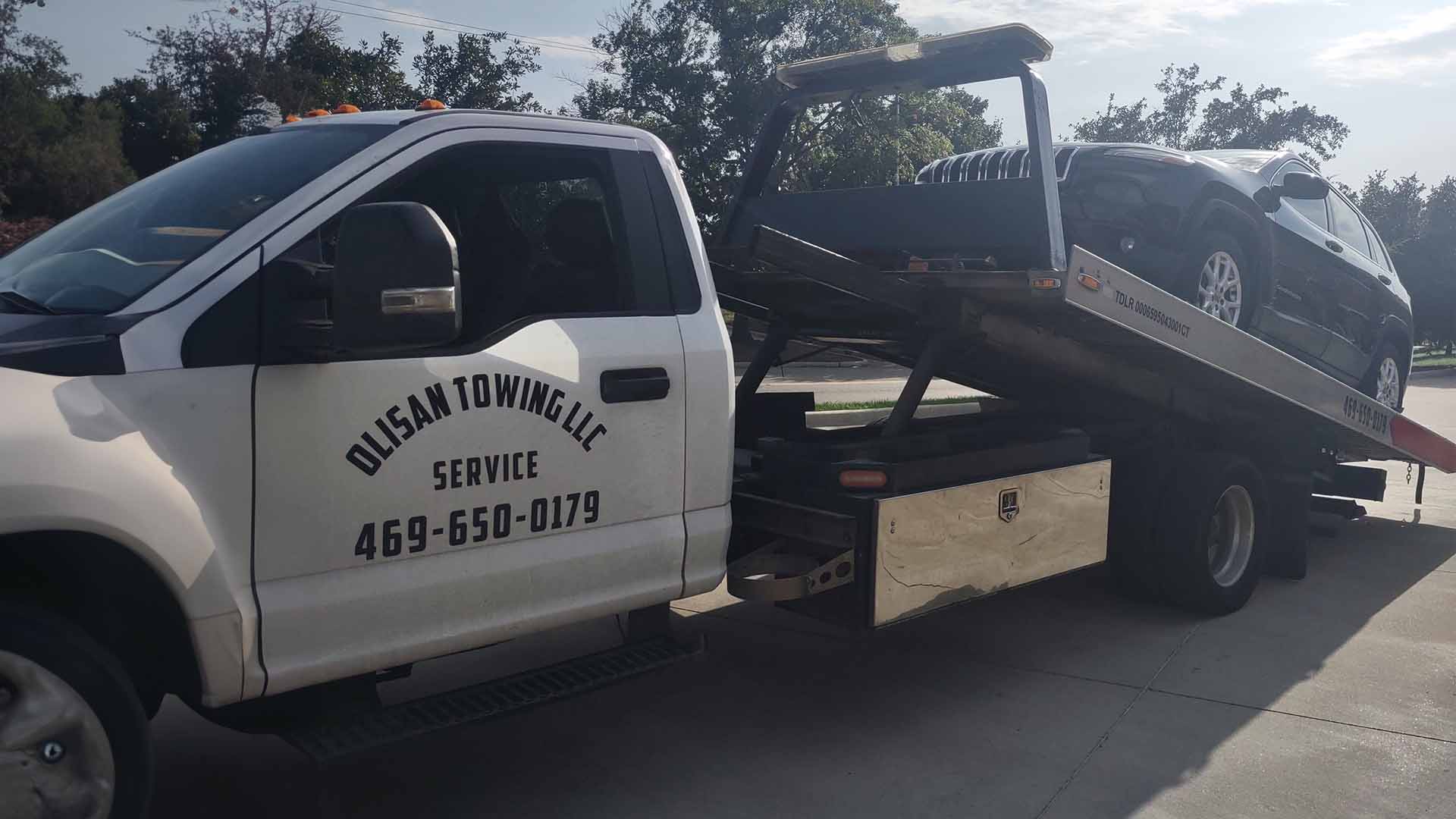 car on the back of a tow truck